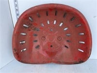Red metal tractor seat