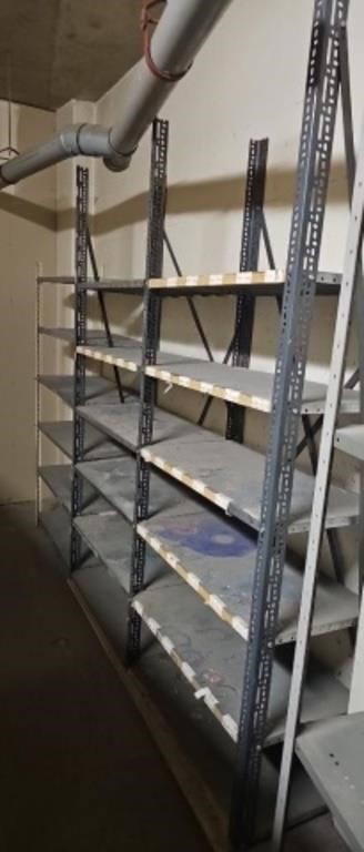 Three sections of metal shelving