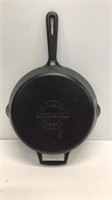 Artisanal cast iron pan. Base measures 8.5 inches