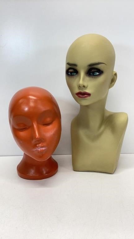 Two vintage mannequin heads. Orange one needs