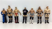 Lot of 7 wrestling action figures.