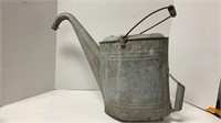 Vintage galvanized steel watering can