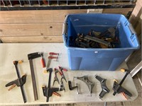 Tub full of many different types of clamps