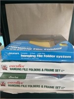 3 unopened hanging file folders and frame set