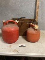 Gas cans and wooden box