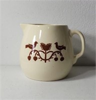 Folk art stoneware glazed pitcher