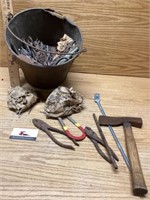 Metal bucket with nails
