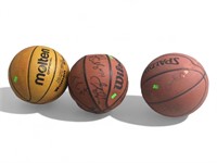 3 signed basketballs could be college basketball