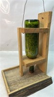 Homemade wood and wine bottle birdfeeder