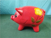 Piggy bank with yellow flowers