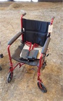 WHEEL CHAIR- SMALL WHEELS WITH LEG RESTS