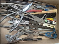 Variety of wrenches, pliers and other hand tools.