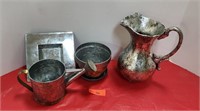 Metal flower pots and water Jug.