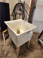 Utility sink w/ hose & cleaners
