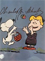 Peanuts Charles Schulz signed photo. GFA Authentic