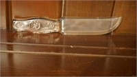 Clear glass knife with flowers on handle