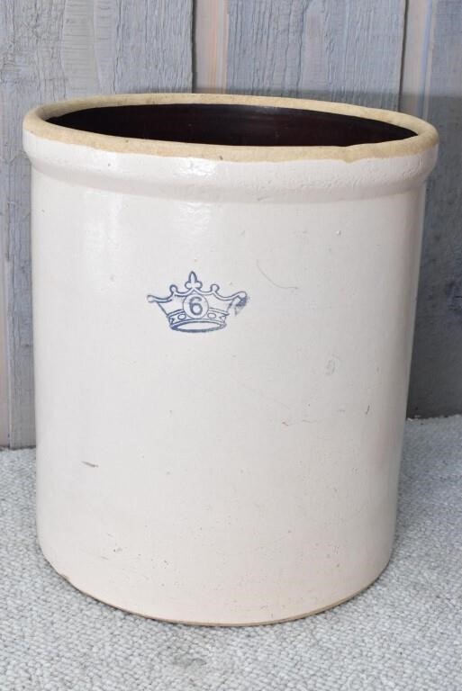 Concrete pot with Crown 6 on the front
