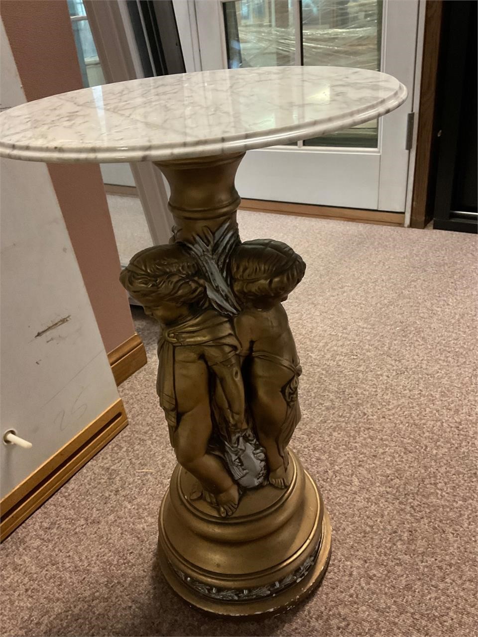 Antique angel sculpture table with marble top