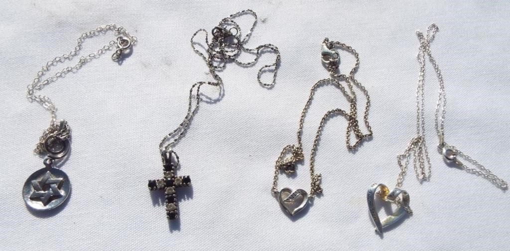 Sterling necklaces with charms. One is vintage