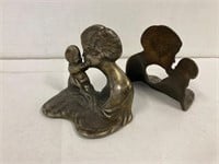 Cast iron mother and baby book ends.