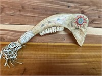 PRIMATIVE WEAPON MADE FROM ANIMAL BONE