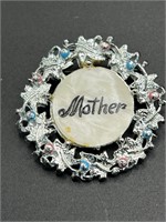 Mother brooch with pearl inlay