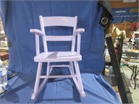 wooden rocking chair .
