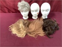 Three Styrofoam Heads And Four Wigs