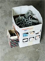 box of pipe hangers & stove bolts