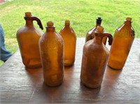 BOX LOT OF ASSORTED OLD AMBER GLASS JARS