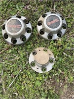 2 gmc 8 lug pattern hubcaps and 1 Chevy  5 lug