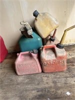 Assortment of 4 gas cans and 1 kerosene can.