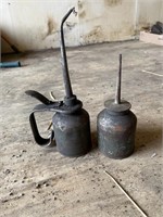 2 old oil cans