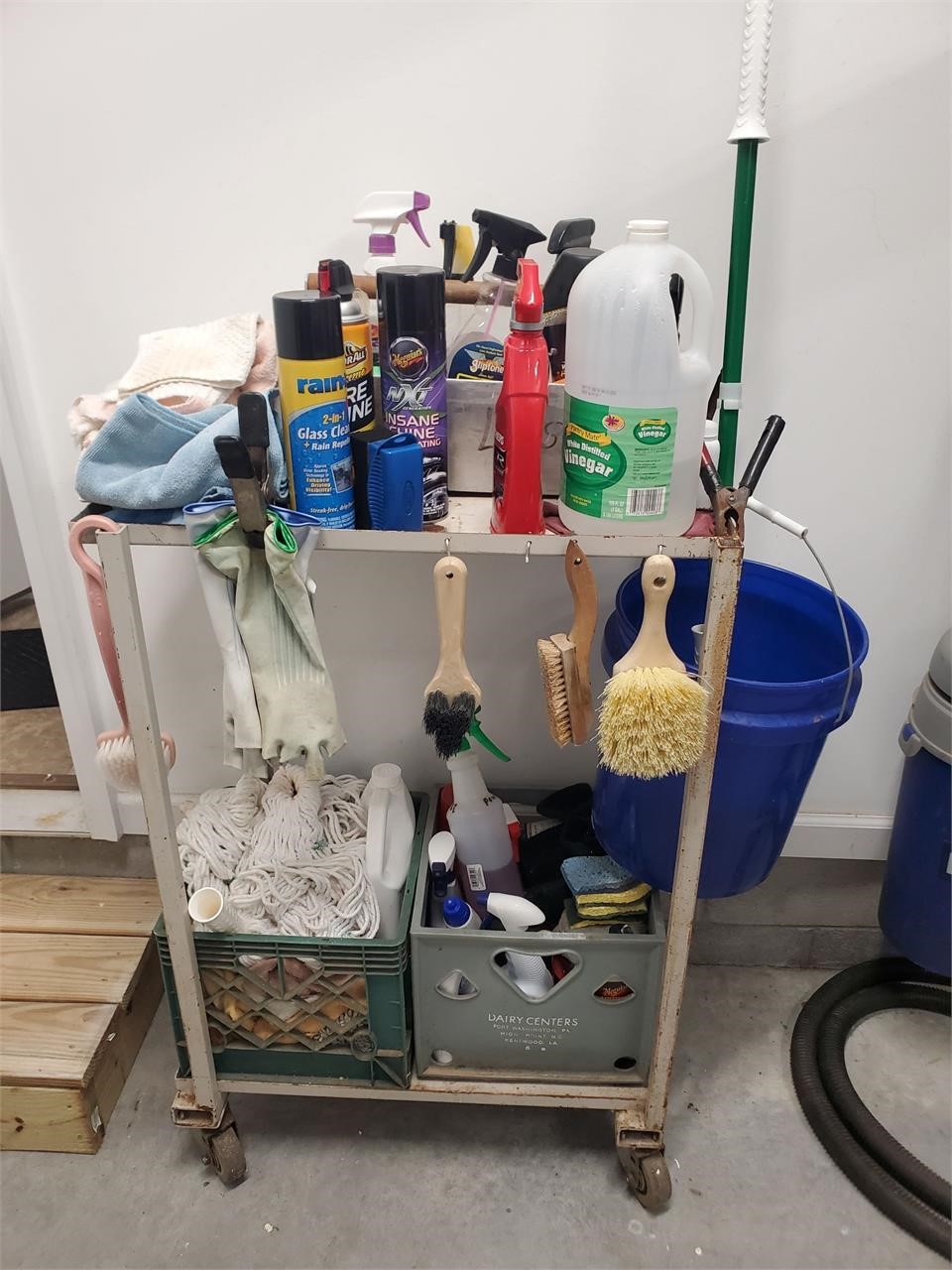 Cleaning supplies and rolling cart