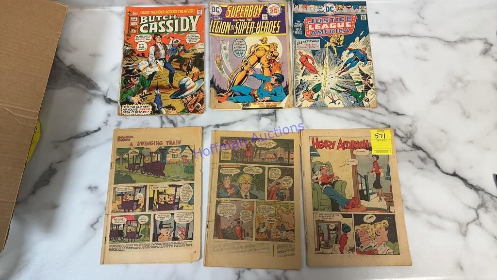 Three 25¢ comics (justice league, super boy, and