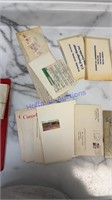 Stamp envelopes and some stamps with binder