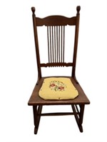 Antique rocker with needlepoint seat