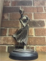 Bronze finish female golfer statue