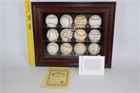 12 Autographed Baseballs in Display Case