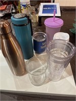 Lot of different travel mugs and others ninja