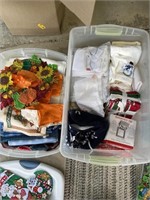 Two totes of Holiday fabric, crafty items, linens