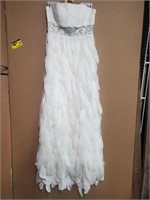 Feather dress size 4. Dress has been worn. Needs
