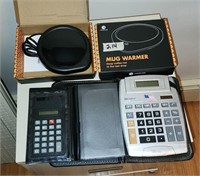 Lot of calculators and a mug warmer