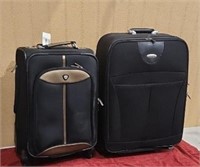 2 Nesting Suit Cases, Smaller One on Wheels.