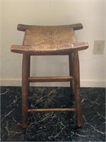 Wooden stool with woven seat