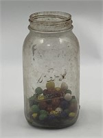Kerr canning jar with several marbles