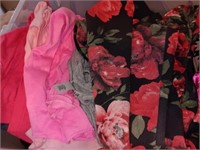 Box of women's clothes, tops pants and more.