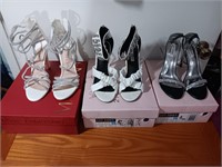 3 pair of women's sz 8 shoes heels in box used.