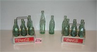 Collection of Coca Cola bottles and 2 early carrie
