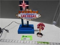 Las Vegas lighted sign and show girl figurine